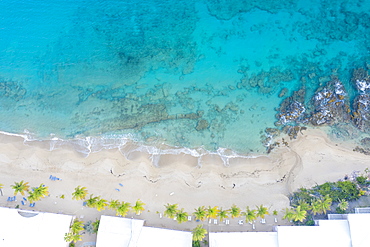 White sand beach washed by waves of Caribbean Sea from above by drone, Morris Bay, Old Road, Antigua, Leeward Islands, West Indies, Caribbean, Central America