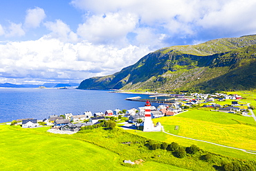 Aerial view by drone of Alnes Lighthouse and village, Godoya Island, Alesund, More og Romsdal County, Norway, Scandinavia, Europe