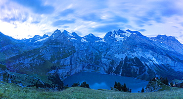 Clouds at dusk over Oeschinensee lake, Bernese Oberland, Kandersteg, Canton of Bern, Switzerland, Europe