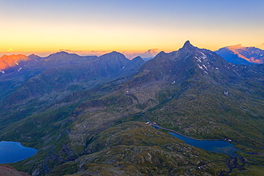 Aerial view of the sky at sunrise over the rocky peaks at Gavia Pass, Valfurva, Valtellina, Sondrio province, Lombardy, Italy, Europe