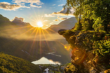 Last rays of sunset over Geiranger village and Geirangerfjord, UNESCO World Heritage Site, Stranda municipality, More og Romsdal, Norway, Scandinavia, Europe