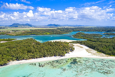 Aerial by drone of white sand beach with turquoise sea surrounded by tropical trees, Ile Aux Cerfs, Flacq, Mauritius, Indian Ocean, Africa