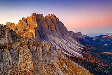 Autumn trees at feet of Furchetta and Sass Rigais, aerial view, Puez-Odle, Funes Valley, Dolomites, Bolzano, South Tyrol, Italy, Europe