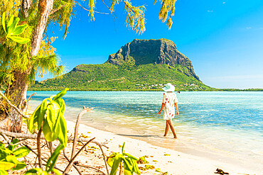 Woman walking on tropical sand beach, Ile aux Benitiers, La Gaulette, Le Morne, Black River, Mauritius, Indian Ocean, Africa