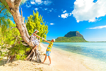 Playful man and woman in love having fun on tropical beach, Ile aux Benitiers, La Gaulette, Le Morne, Mauritius, Indian Ocean, Africa