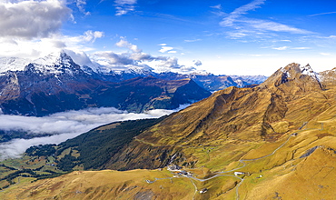 Aerial panoramic of Eiger and sea of clouds surrounding First and Grindelwald in autumn, Bernese Alps, Canton of Bern, Switzerland, Europe