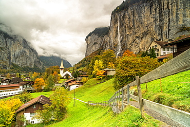 Path in the autumn landscape of Lauterbrunnen village towards Trummelbach Falls, Bern canton, Bernese Oberland, Switzerland, Europe