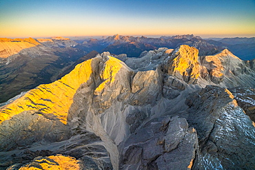 Aerial view of autumn sunset over the majestic peaks of Catinaccio Group, Dolomites, South Tyrol, Italy, Europe