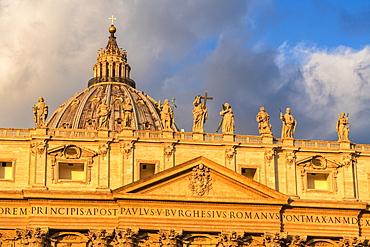 Sunrise over dome and religious holy statues of St. Peter's Basilica (Basilica di San Pietro), Vatican City, UNESCO World Heritage Site, Rome, Lazio, Italy, Europe