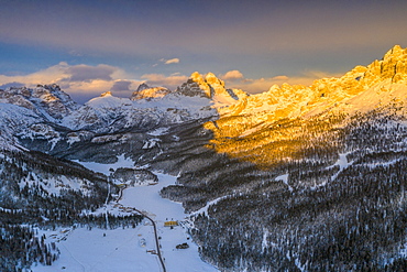 Panoramic view by drone of Tre Cime di Lavaredo and Cadini di Misurina peaks at sunset in winter, Dolomites, Belluno, Veneto, Italy, Europe