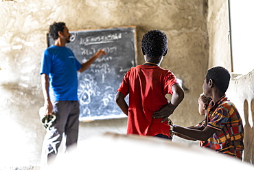 Teacher and kids in school classroom, Melabday, Asso Bhole, Danakil Depression, Afar Region, Ethiopia, Africa