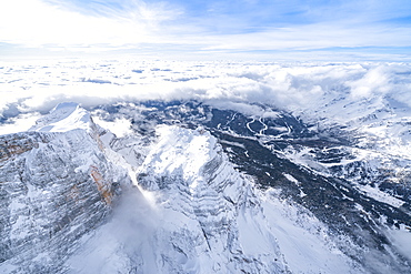 Monte Pelmo surrounded by a sea of clouds in winter, aerial view, Dolomites, Belluno province, Veneto, Italy, Europe