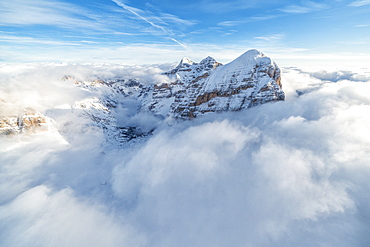 Aerial view of the snow capped Tofane group in a sea of clouds, Dolomites, Belluno province, Veneto, Italy, Europe