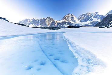 Frozen water of Forbici Lake during the spring thaw, Valmalenco, Valtellina, Sondrio province, Lombardy, Italy, Europe