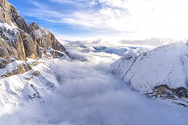 Aerial view of Valle Ombretta covered by clouds from Marmolada, Dolomites, Veneto, Italy, Europe