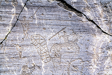 Rock drawing of warrior with spear on horseback, Naquane Park of Rupestrian Engravings, Capo di Ponte, Valcamonica (Val Camonica), Brescia province, Lombardy, Italy, Europe