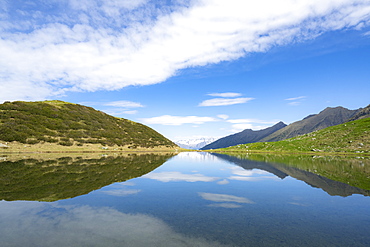 Mountains reflected in the blue water of Porcile Lakes, Tartano Valley, Valtellina, Sondrio province, Lombardy, Italy, Europe