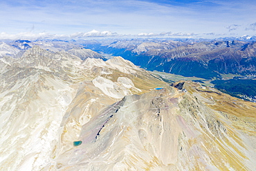 Aerial panoramic by drone of majestic Piz Nair mountain and lake Lej Da La Pesch, Engadine, canton of Graubunden, Switzerland, Europe