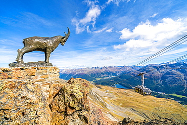 Ibex statue on rocks surrounding the cable car going up to Piz Nair, St. Moritz, Engadine, canton of Graubunden, Switzerland, Europe