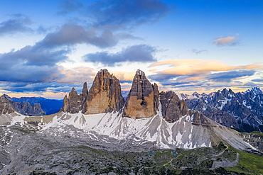 Aerial view of Tre Cime di Lavaredo and Grava Longa lakes at sunset, Sesto Dolomites Natural Park, South Tyrol, Italy, Europe