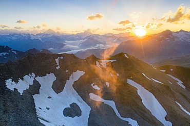 Last rays of sunset light the rocky mountain peaks, Furka Pass, Canton Uri, Switzerland, Europe