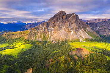 Aerial view of Sass De Putia (Peitlerkofel) and canyon surrounded by woods, Passo Delle Erbe, Dolomites, South Tyrol, Italy, Europe