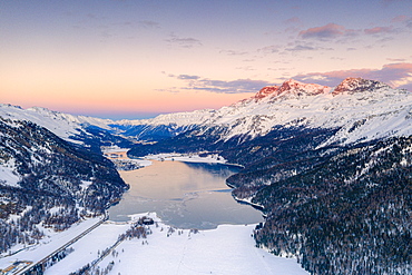 Aerial view of frozen Lake Silvaplana and Piz Corvatsch covered with snow at sunset, Engadine, Graubunden canton, Swiss Alps, Switzerland, Europe