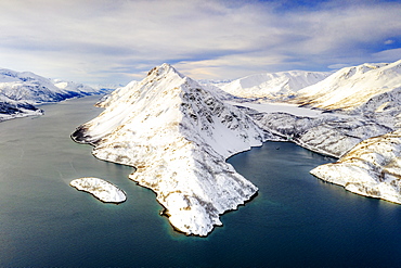 Aerial view of snow capped mountains along the clear water of Altafjord, Troms og Finnmark county, Northern Norway, Scandinavia, Europe