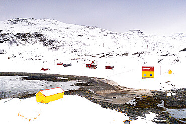 Colorful wood houses in the fishing village of Breivikbotn covered with snow, Soroya Island, Hasvik, Troms og Finnmark, Arctic, Norway, Scandinavia, Europe