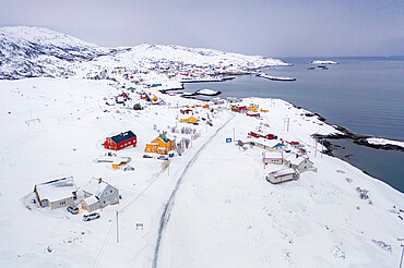 Fishing village of Breivikbotn covered with snow, Soroya Island, Hasvik municipality, Troms og Finnmark, Northern Norway, Scandinavia, Europe