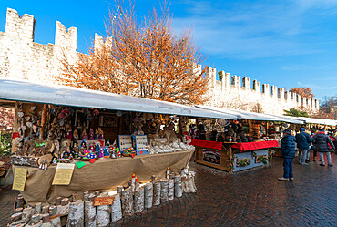 Artcraft and traditional products at the Chirstmas markets in the old town of Trento, Trentino, Italy, Europe