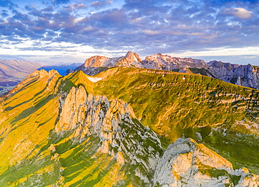 Clouds at dawn over the majestic Santis and Saxer Lucke mountains, aerial view, Appenzell Canton, Alpstein Range, Switzerland, Europe