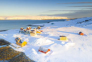 Traditional houses in the snow at dawn, Veines, Kongsfjord, Varanger Peninsula, Troms og Finnmark, Norway, Scandinavia, Europe