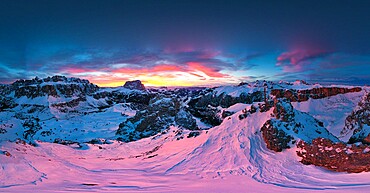 Pink sunset on the snowcapped Gran Cir, Odle, Sassolungo and Sella Group mountains in winter, Dolomites, South Tyrol, Italy, Europe