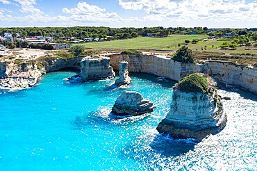 Faraglioni of Torre Sant'Andrea and cliffs framed by turquoise sea, Lecce province, Salento, Apulia, Italy, Europe