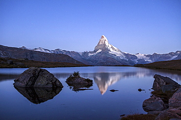 The Matterhorn reflected in Stellisee at sunrise, Zermatt, Canton of Valais, Pennine Alps, Swiss Alps, Switzerland, Europe