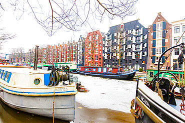 Retro style colorful canal houses on Damrak waterfront, Amsterdam, North Holland, The Netherlands, Europe