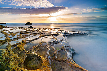 Golden hour over the ocean waves and rocks at El Cotillo beach, Fuerteventura, Canary Islands, Spain, Atlantic, Europe