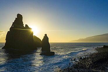 Ilheus da Rib and Ribeira da Janela rock formations lit by sun rays at dawn, Atlantic Ocean, Porto Moniz, Madeira, Portugal, Atlantic, Europe