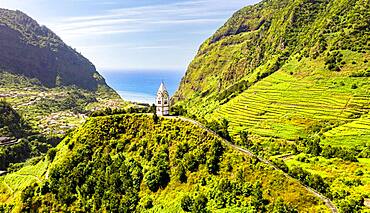 The chapel-tower Nossa Senhora de Fatima on top of green hills, Sao Vicente, Madeira island, Portugal, Atlantic, Europe