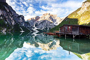 Lake Braies (Pragser Wildsee) at sunrise with Croda del Becco mountain reflected in water, Dolomites, South Tyrol, Italy, Europe