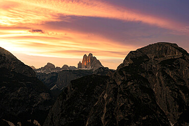 Tre Cime di Lavaredo under the burning sky at sunset, Sesto (Sexten) Dolomites, Bolzano province, South Tyrol, Italy, Europe