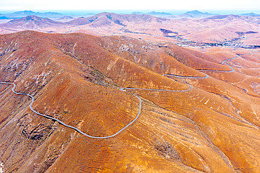 Aerial view of empty desert road, Mirador del Risco de las Penas viewpoint, Pajara, Fuerteventura, Canary Islands, Spain, Atlantic, Europe