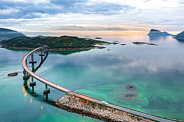 Aerial view of car traveling on Sommaroy bridge at sunset, Sommaroy, Troms county, Northern Norway, Scandinavia, Europe