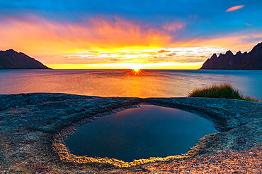 Ersfjord and Steinfjord fjords lit by midnight sun from rock formation at Tungeneset viewpoint, Senja, Troms county, Norway, Scandinavia, Europe