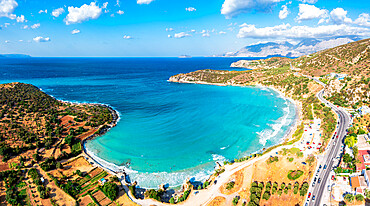 Aerial view of Almyros Beach washed by the turquoise sea in the gulf of Mirabella, Agios Nikolaos, Crete island, Greek Islands, Greece, Europe