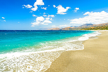 Waves of turquoise clear sea crashing on white sand of Triopetra beach, Plakias, Crete island, Greek Islands, Greece, Europe