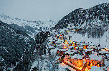 Small village of Pianazzo on top of snowcapped mountain after a snowfall, Madesimo, Valle Spluga, Valtellina, Lombardy, Italy, Europe