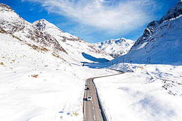 Aerial view of cars driving on mountain road in winter, Julier Pass, Albula district, Engadine, canton of Graubunden, Switzerland, Europe