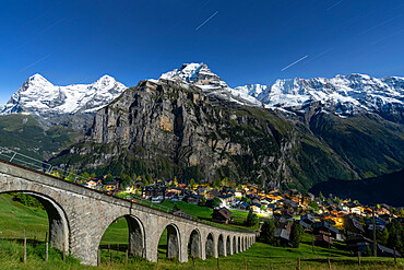 Alpine village of Murren and funicular railway lit by star trail, Lauterbrunnen, Jungfrau Region, Bern Canton, Swiss Alps, Switzerland, Europe